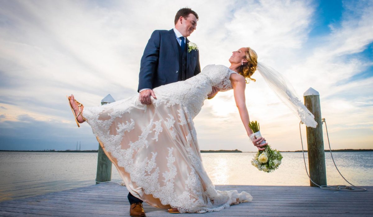 Bride and Groom Dipping on a Dock