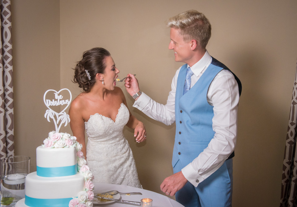 Wedding Cake Cutting Photo – Bride Eats the Cake